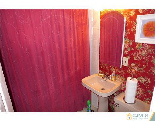 4 Halstead Road New Brunswick, NJ 08901 - Photo 6 of 17 a bathroom with sink and mirror
