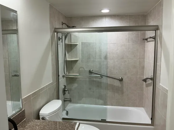 a bathroom with a shower and a toilet