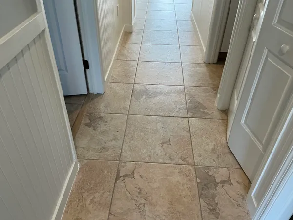 a bathroom with a sink and glass door