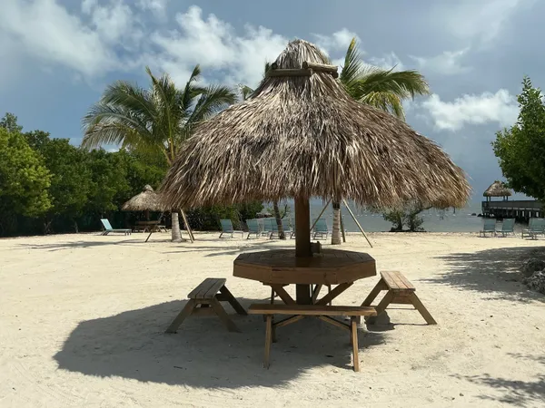 a house with swimming pool and sitting area