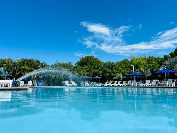 a view of swimming pool and outdoor seating