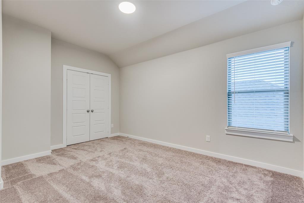 2544 Rambling Road Celina, TX 75009 - Photo 12 of 25 Unfurnished room with vaulted ceiling and light carpet