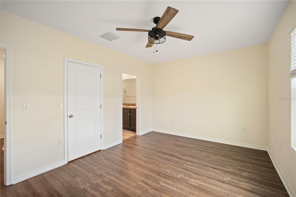 8619 Falling Blue Place Riverview, FL 33578 - Photo 15 of 27 wooden floor in an empty room