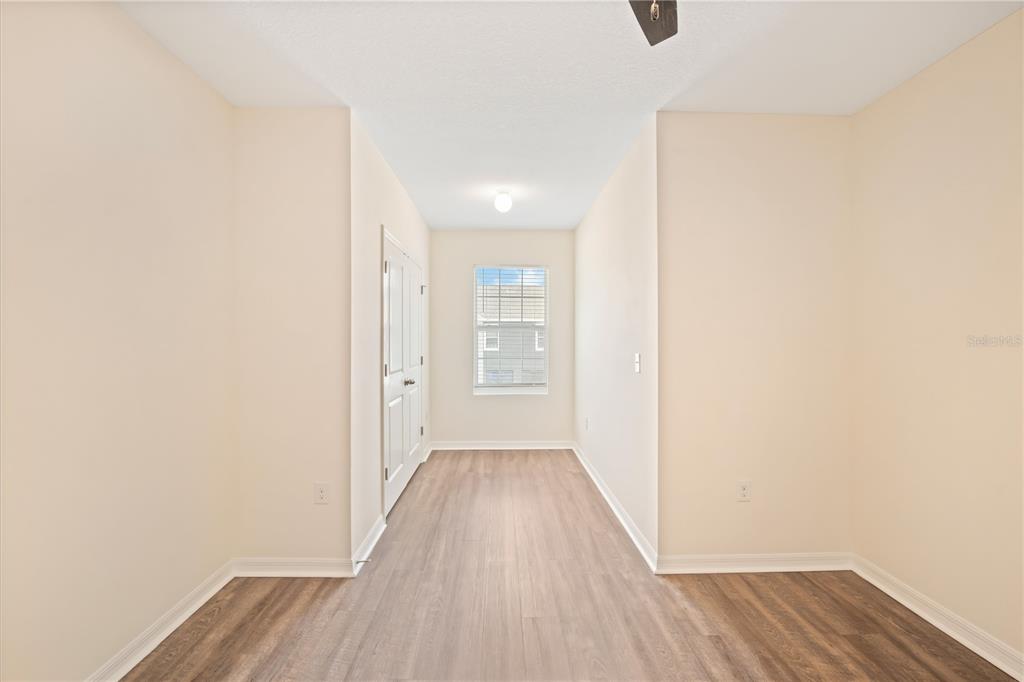 8619 Falling Blue Place Riverview, FL 33578 - Photo 20 of 27 a view of a hallway with wooden floor