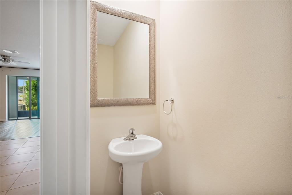 8619 Falling Blue Place Riverview, FL 33578 - Photo 5 of 27 a bathroom with a sink and a mirror