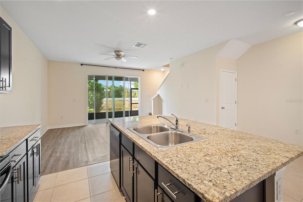 8619 Falling Blue Place Riverview, FL 33578 - Photo 10 of 27 a kitchen with a sink and cabinets