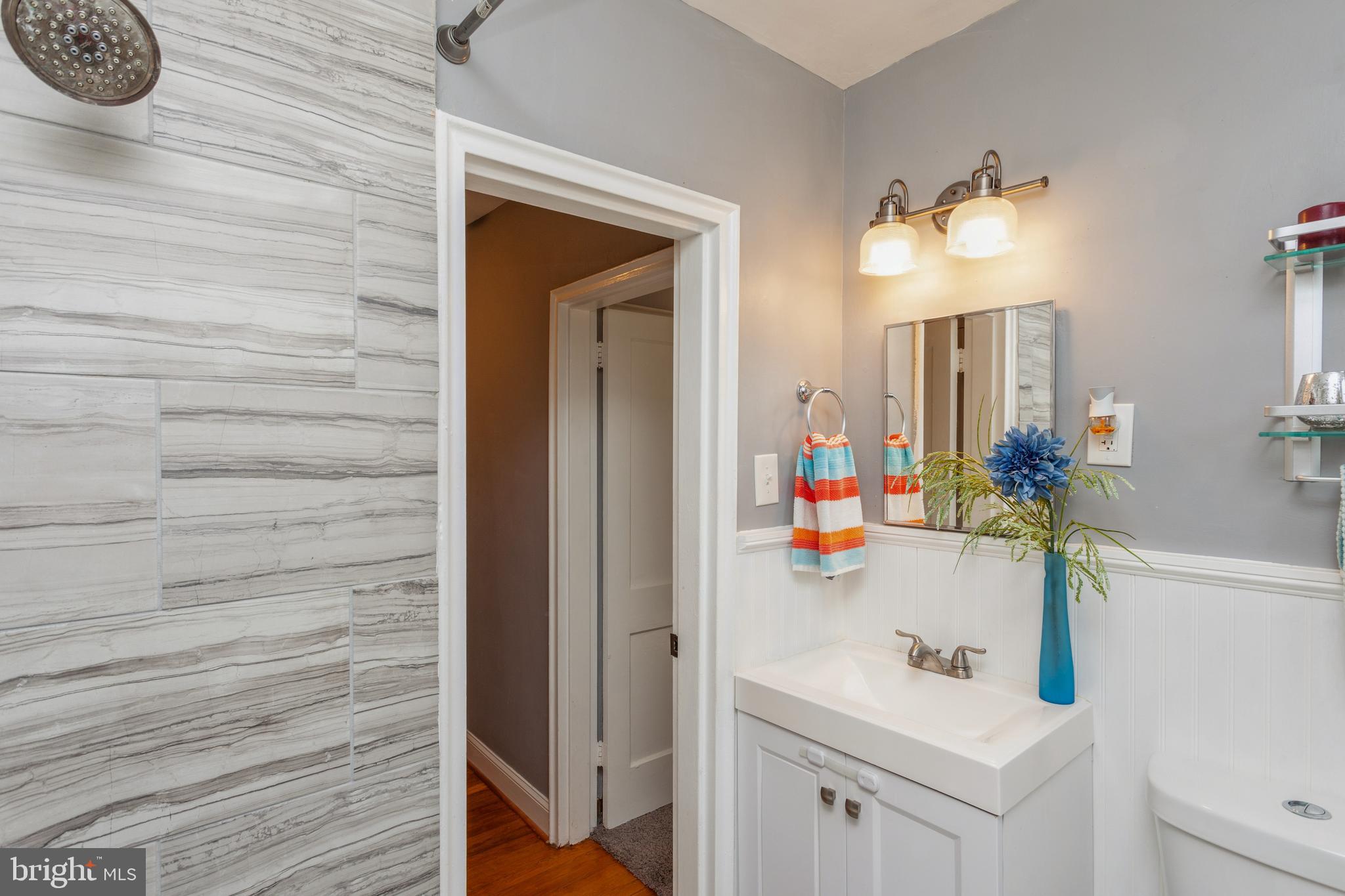 1028 Stamford Road Baltimore, MD 21229 - Photo 30 of 48 Tiled shower nickel finishes.