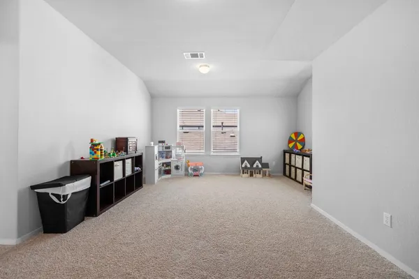 a view of a livingroom with furniture and a window