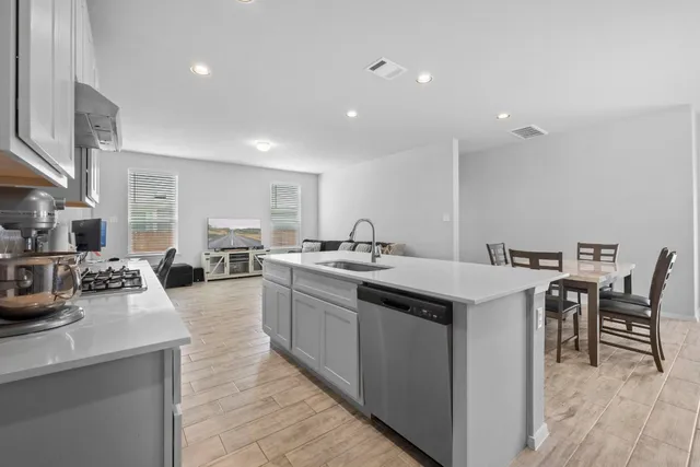 a kitchen with counter top space and sink