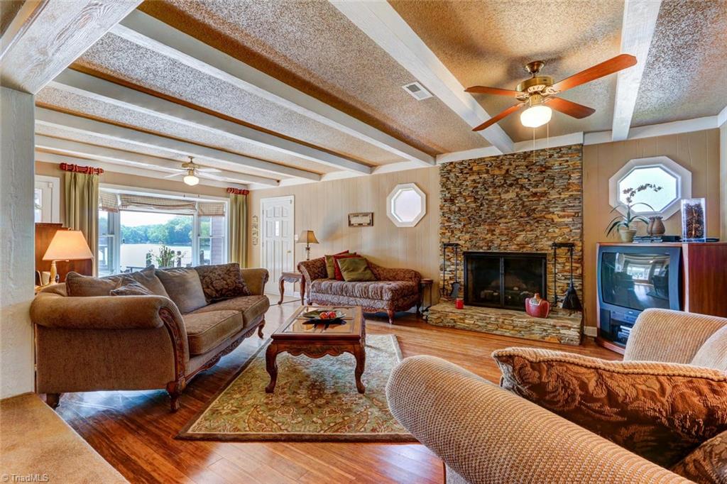 803 Riverside Drive Lexington, NC 27292 - Photo 8 of 30 Living room with Stone Fireplace and exposed beams.