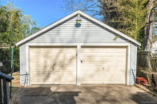 a view of a small house with backyard
