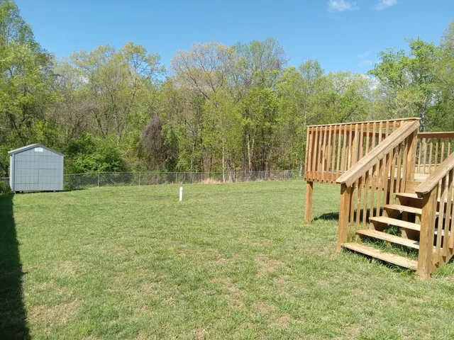 a view of a deck with a yard