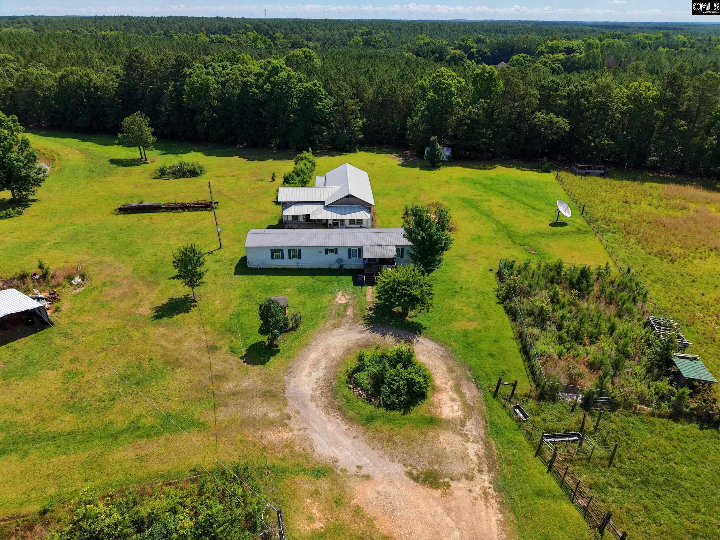 3140 Highway 702 Chappells, SC 29037 - Photo 4 of 39 a view of a lake with a yard