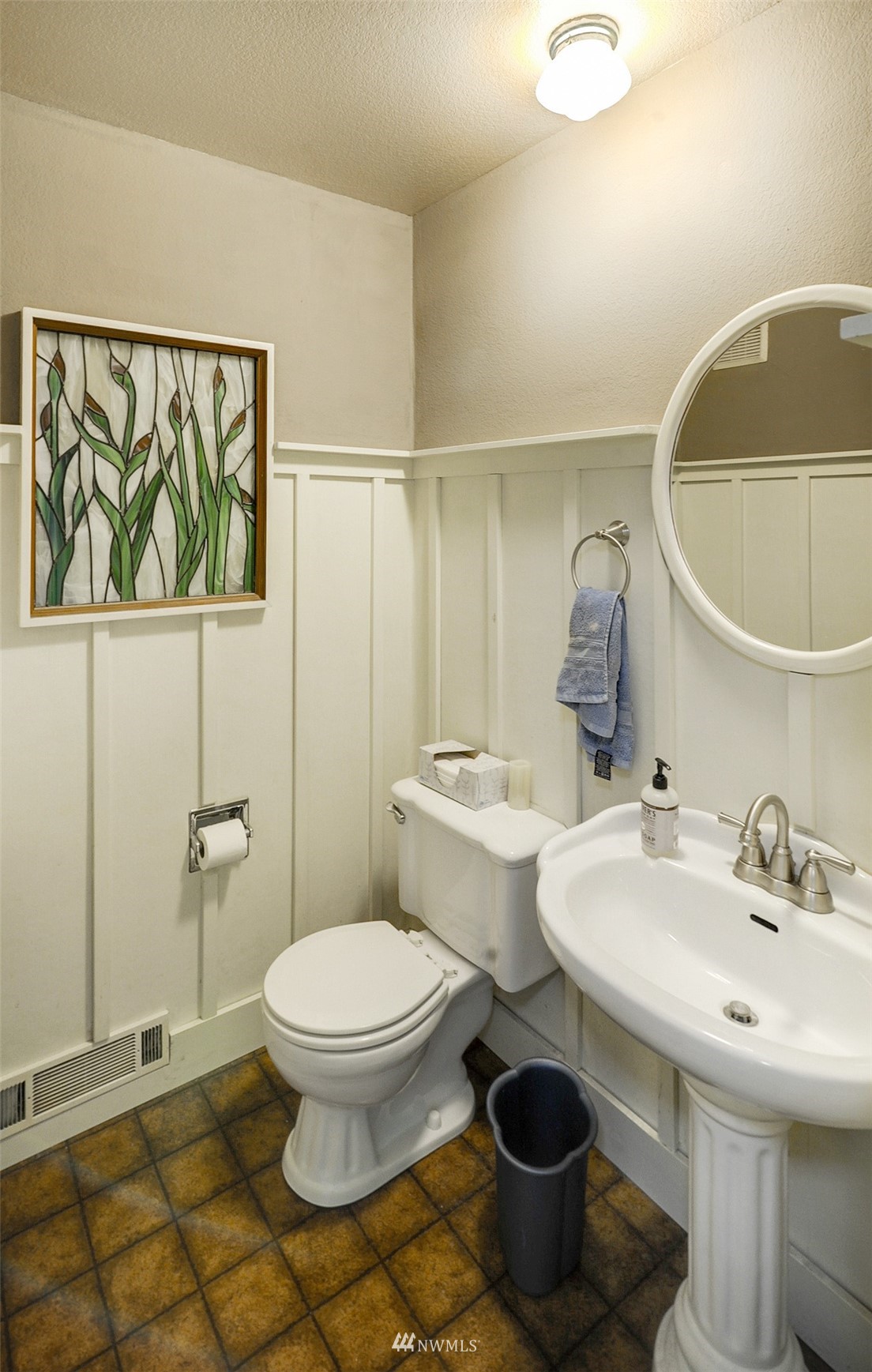 20414 West Richmond Road Bothell, WA 98021 - Photo 14 of 30 a bathroom with a toilet a sink and mirror