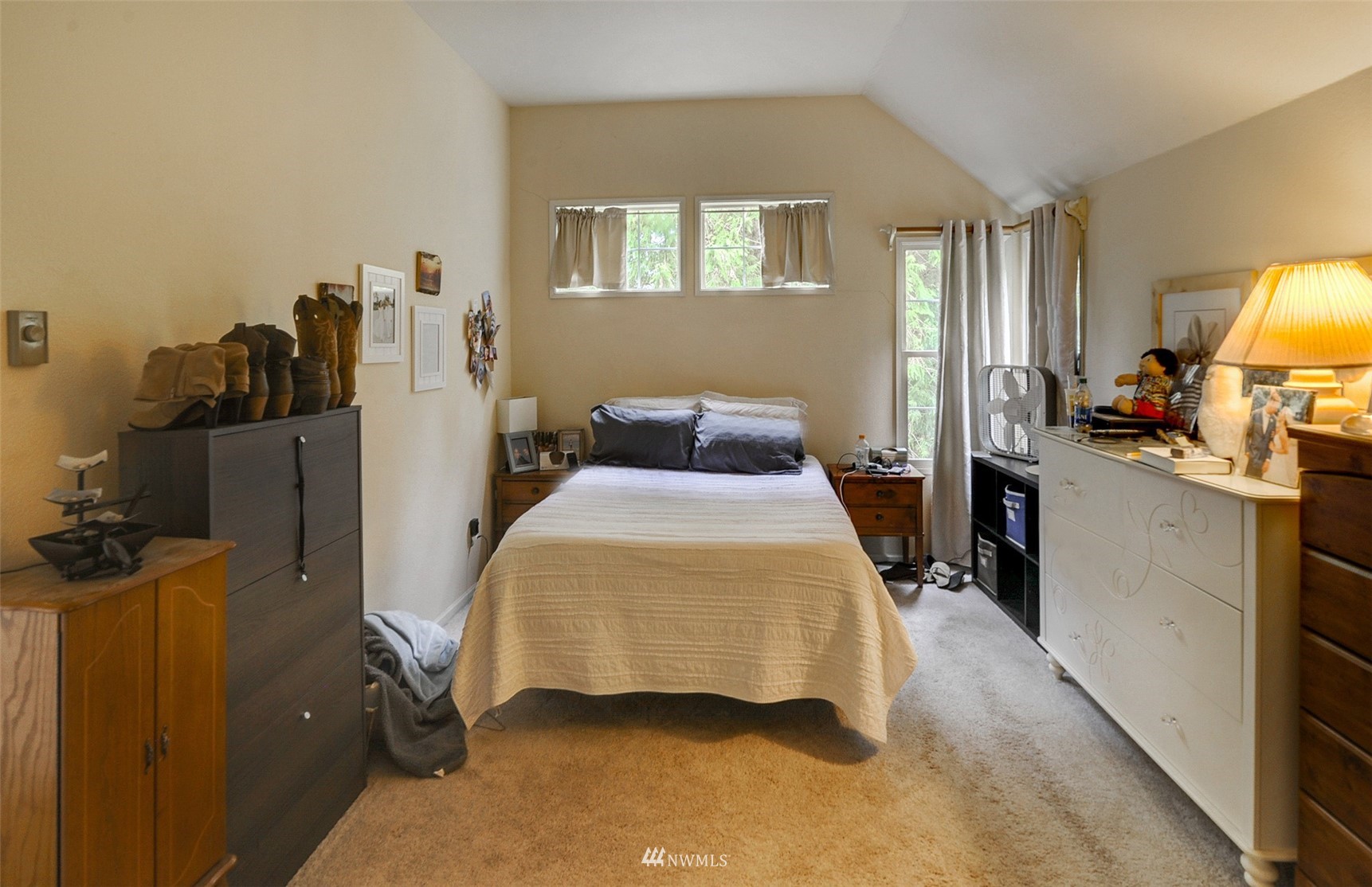 20414 West Richmond Road Bothell, WA 98021 - Photo 19 of 30 a bedroom with a bed and wooden floor