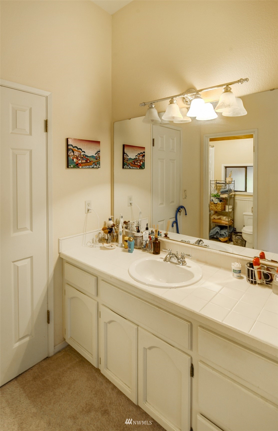 20414 West Richmond Road Bothell, WA 98021 - Photo 20 of 30 a bathroom with a sink and a mirror