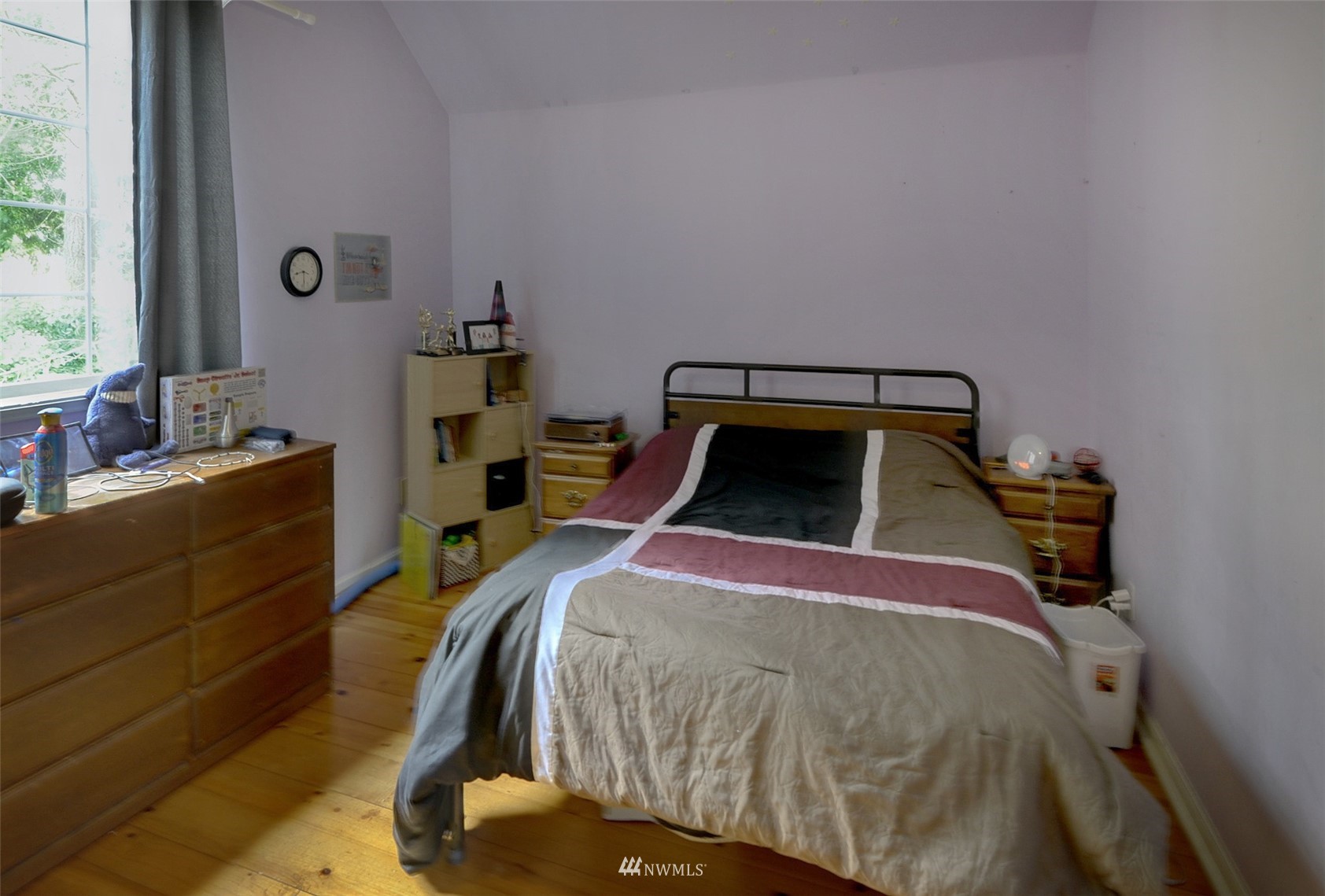 20414 West Richmond Road Bothell, WA 98021 - Photo 21 of 30 a bedroom with a bed and a window