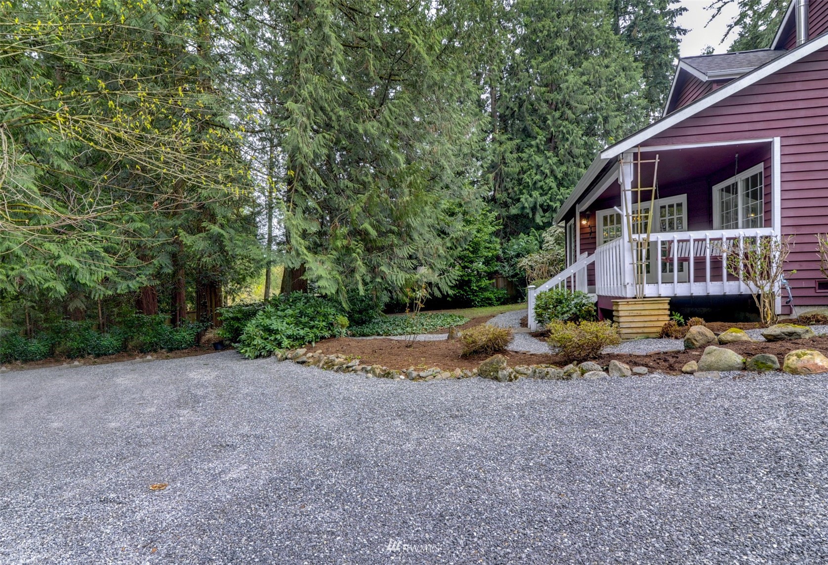 20414 West Richmond Road Bothell, WA 98021 - Photo 28 of 30 a view of a house with a yard and large trees