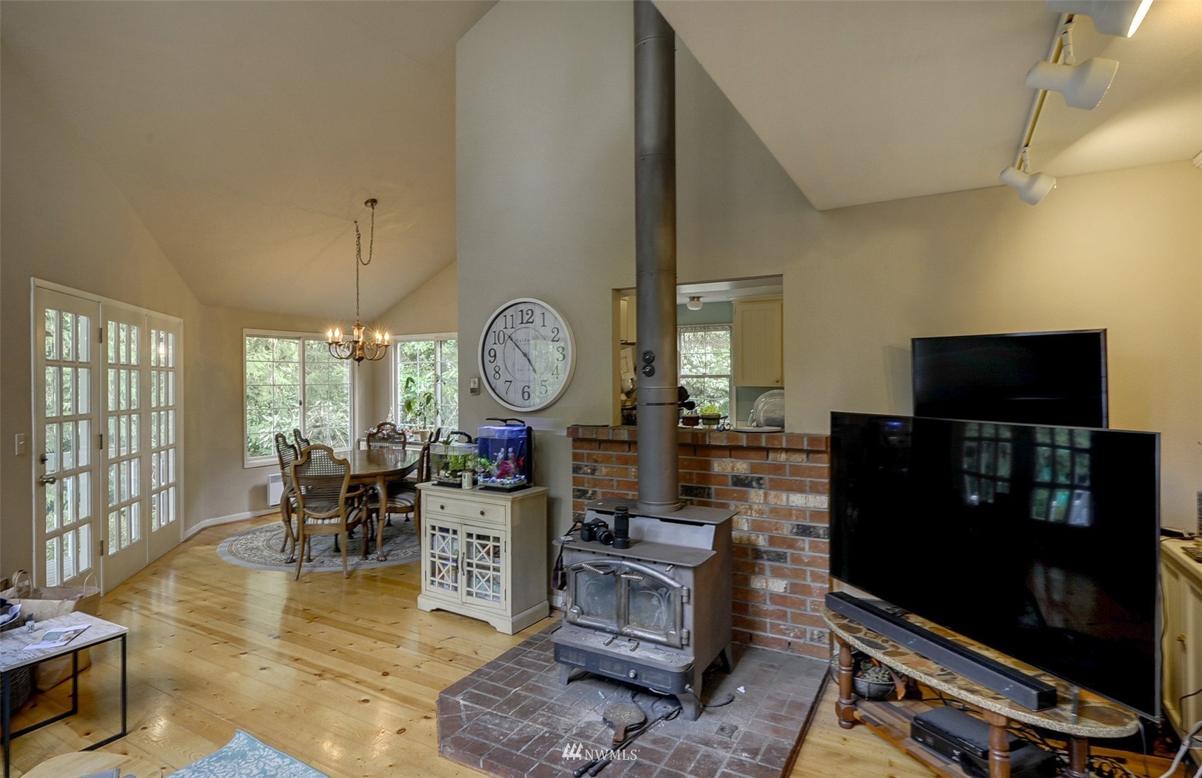 20414 West Richmond Road Bothell, WA 98021 - Photo 5 of 30 a living room with fireplace furniture and a flat screen tv