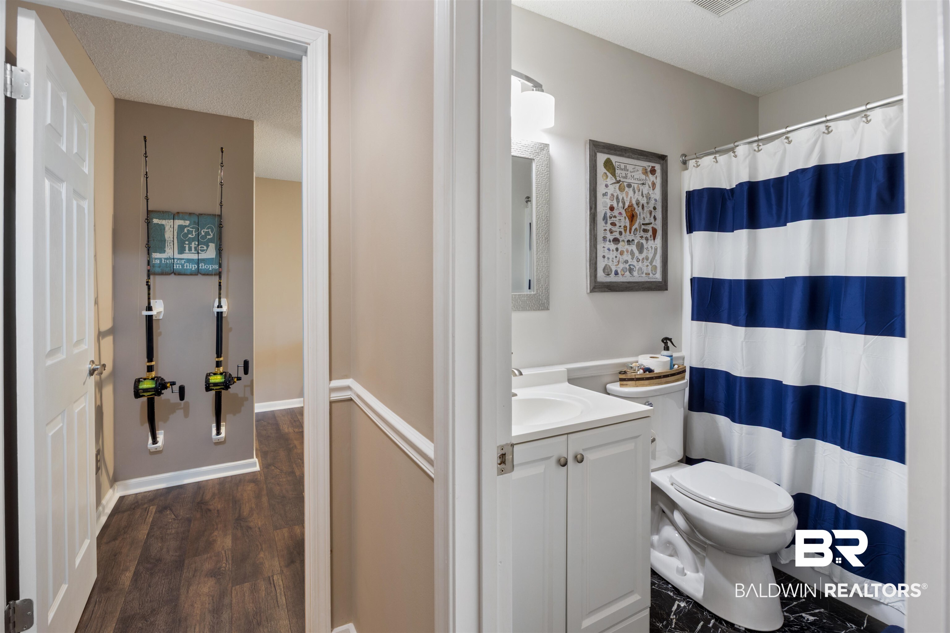 9771 Clarke Ridge Road Foley, AL 36535 - Photo 43 of 72 Full bath featuring toilet, a shower with curtain, vanity, and a textured ceiling.