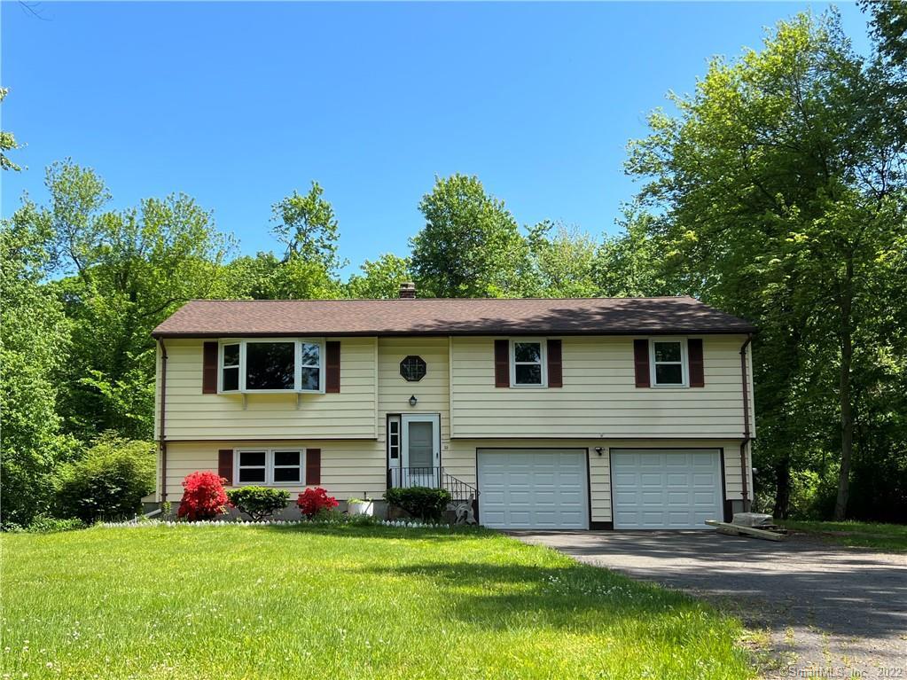 front view of home, cozy and nestled towards the back of the cul-de-sac with complete privacy
