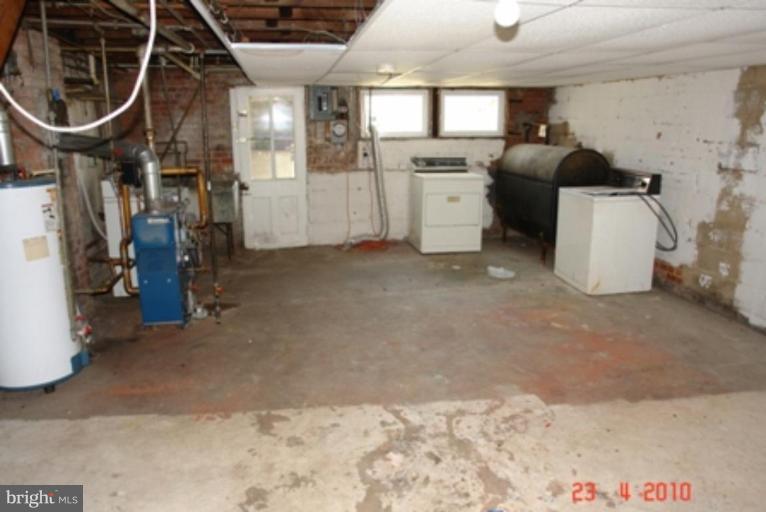 95 Willow Spring Road Dundalk, MD 21222 - Photo 4 of 5 a storage room with washer and dryer