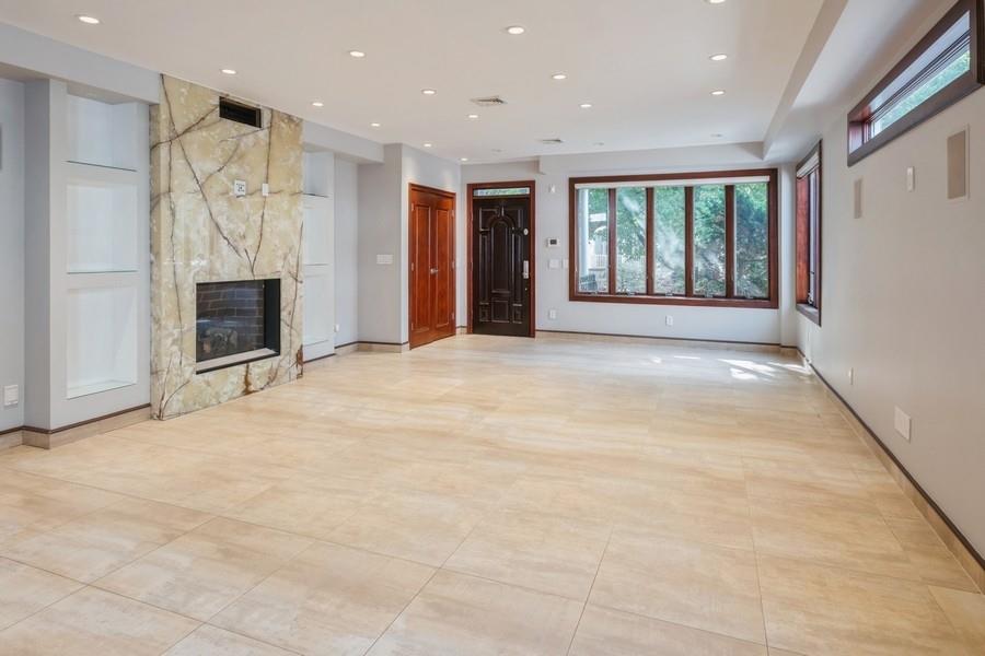211 81st Street Brooklyn, NY 11209 - Photo 11 of 35 a view of an empty room with a fireplace and a window