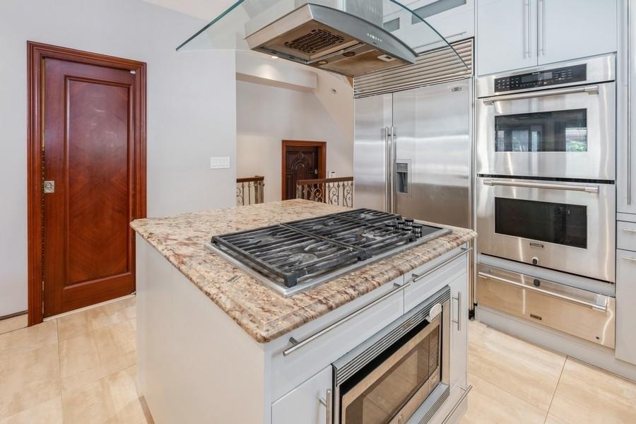 211 81st Street Brooklyn, NY 11209 - Photo 15 of 35 a kitchen with a stove and a microwave