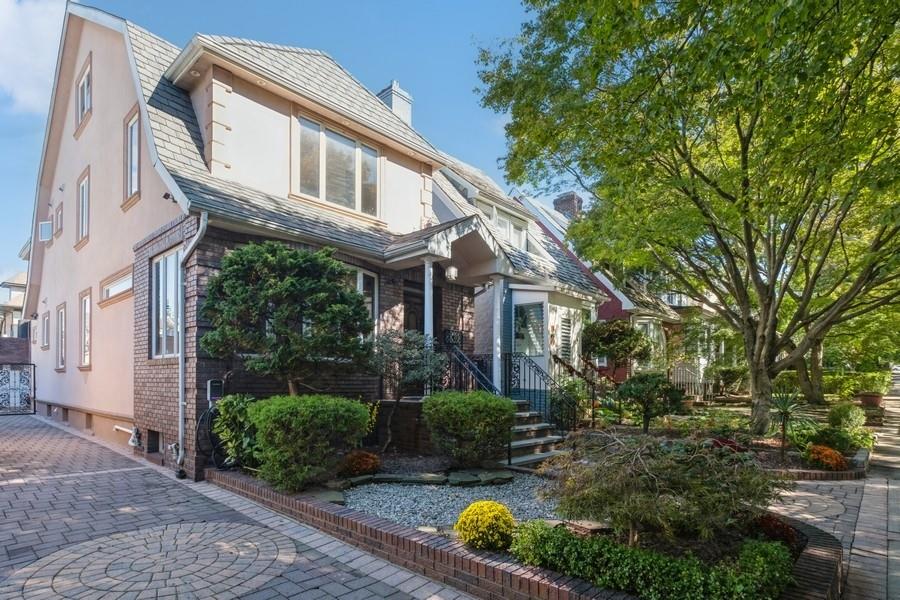 211 81st Street Brooklyn, NY 11209 - Photo 2 of 35 a front view of a house with garden