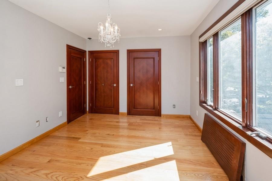 211 81st Street Brooklyn, NY 11209 - Photo 22 of 35 a view of a hallway with a chandelier