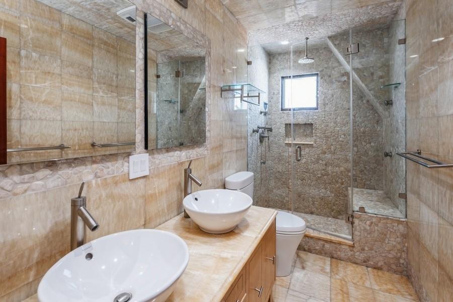 211 81st Street Brooklyn, NY 11209 - Photo 24 of 35 a bathroom with a sink toilet and shower