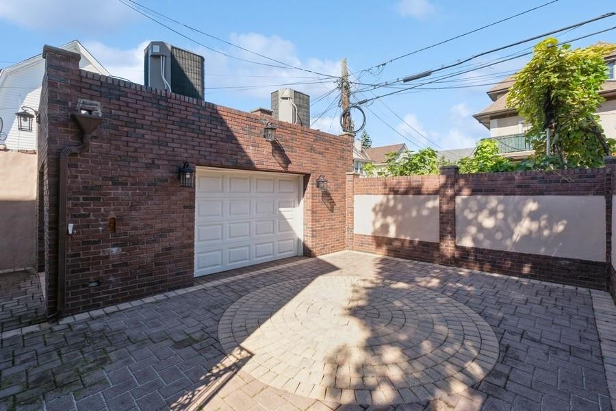 211 81st Street Brooklyn, NY 11209 - Photo 33 of 35 a front view of a house with a yard