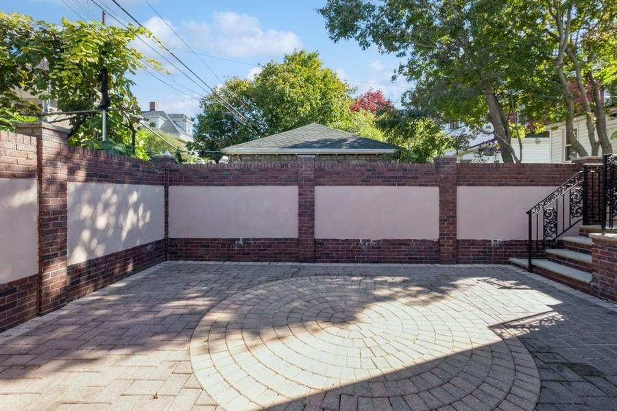 211 81st Street Brooklyn, NY 11209 - Photo 34 of 35 a view of a house with a yard