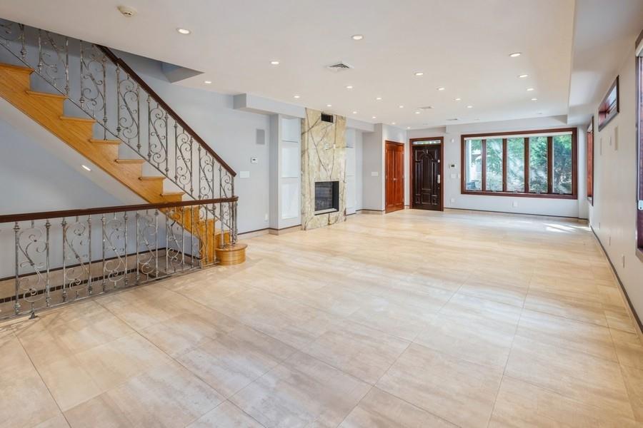 211 81st Street Brooklyn, NY 11209 - Photo 10 of 35 a view of an empty room with wooden floor and a window