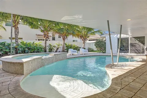 a view of a swimming pool with a sitting space