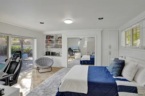 a living room with furniture a rug and a window