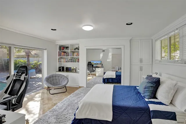 a living room with furniture a rug and a window