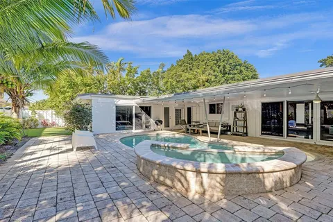 swimming pool view with a outdoor seating