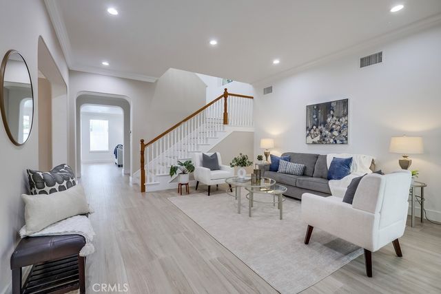 a kitchen with stainless steel appliances granite countertop a sink and cabinets