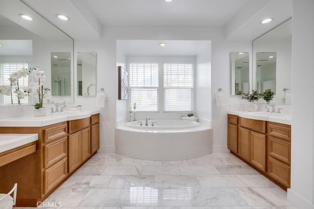 a view of a patio with a table and chairs under an umbrella