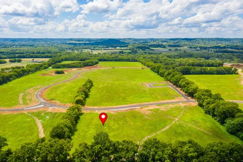 a view of a swimming pool with a lake view