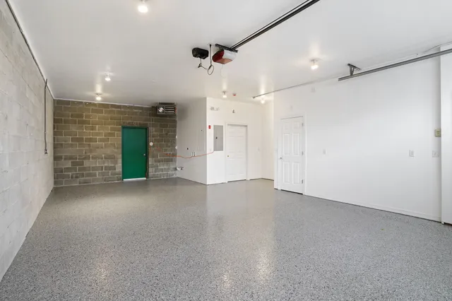 an empty room with a empty space and windows