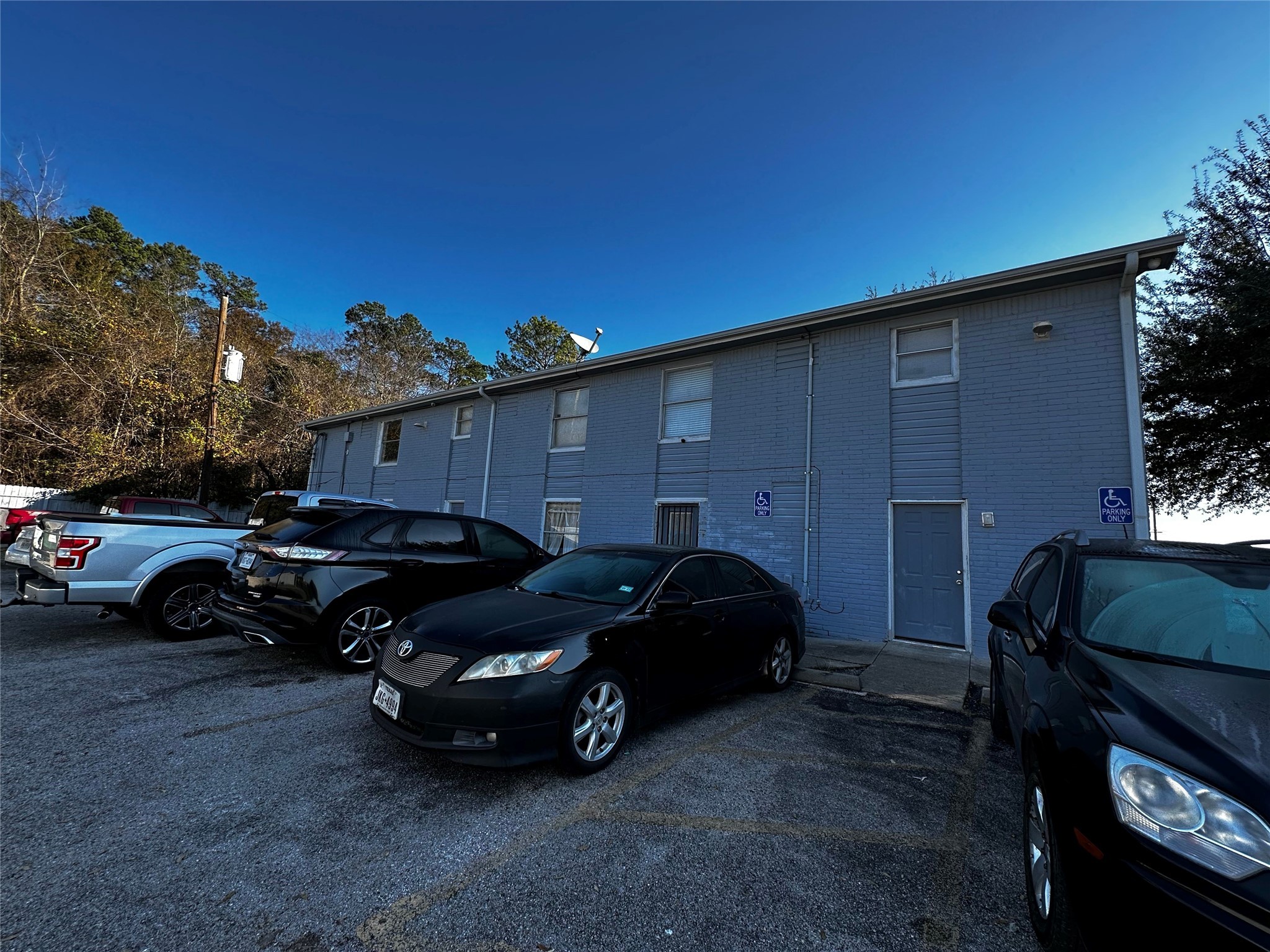 7201 Hallshire Drive, Unit 233 Houston, TX 77016 - Photo 2 of 12 a view of a car parked in front of a house