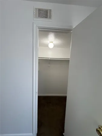 an empty room with a empty space and windows