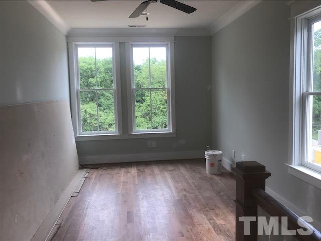 1005 Norris Street Raleigh, NC 27604 - Photo 17 of 25 a view of room with a window and wooden floor
