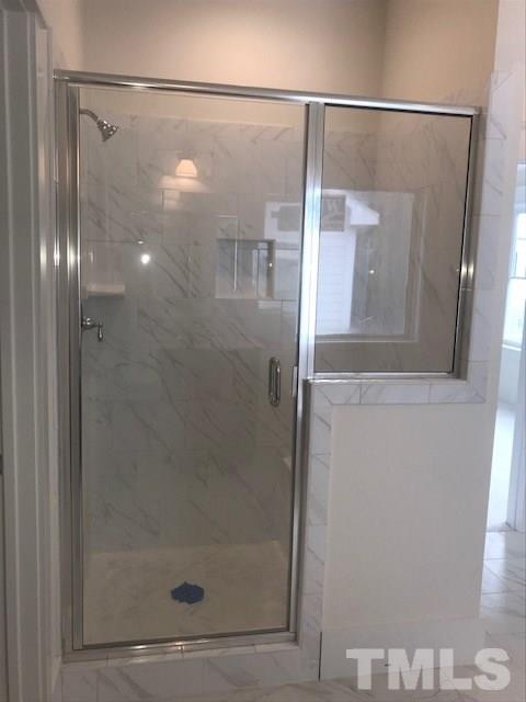 1005 Norris Street Raleigh, NC 27604 - Photo 24 of 25 a bathroom with a glass shower door