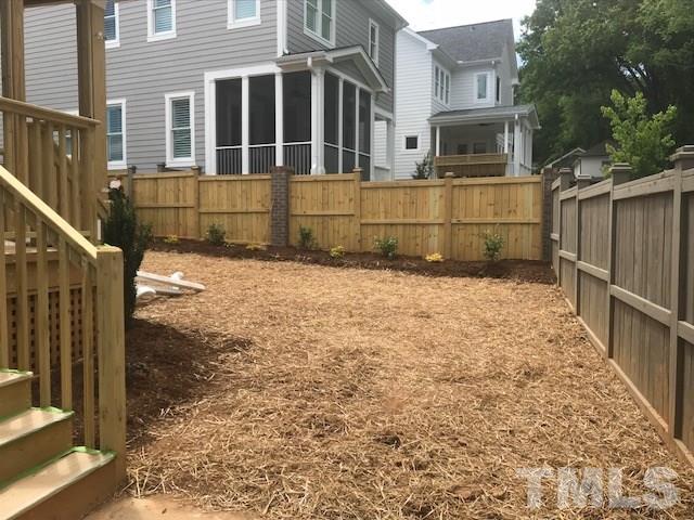1005 Norris Street Raleigh, NC 27604 - Photo 5 of 25 a view of a house with a wooden fence