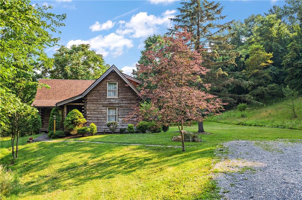 282 Merriman Road Sewickley, PA 15143 - Photo 1 of 25 a view of a house with yard and a garden