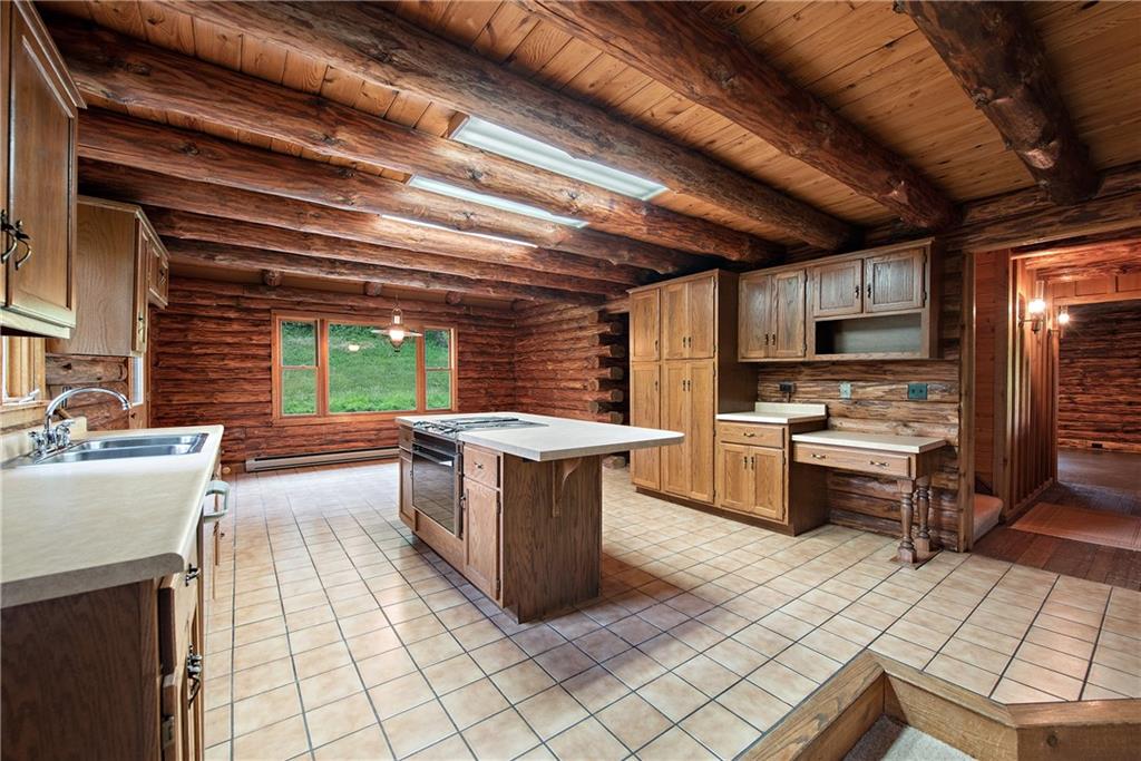 282 Merriman Road Sewickley, PA 15143 - Photo 13 of 25 a kitchen with stainless steel appliances granite countertop a stove a sink and a microwave
