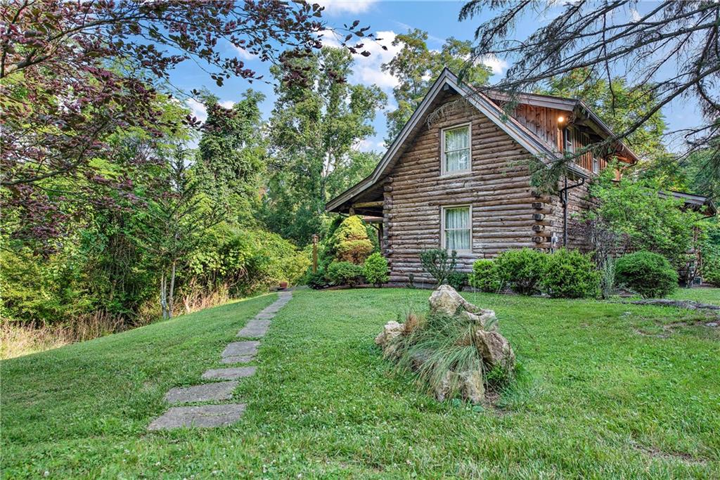 282 Merriman Road Sewickley, PA 15143 - Photo 24 of 25 a front view of a house with a yard